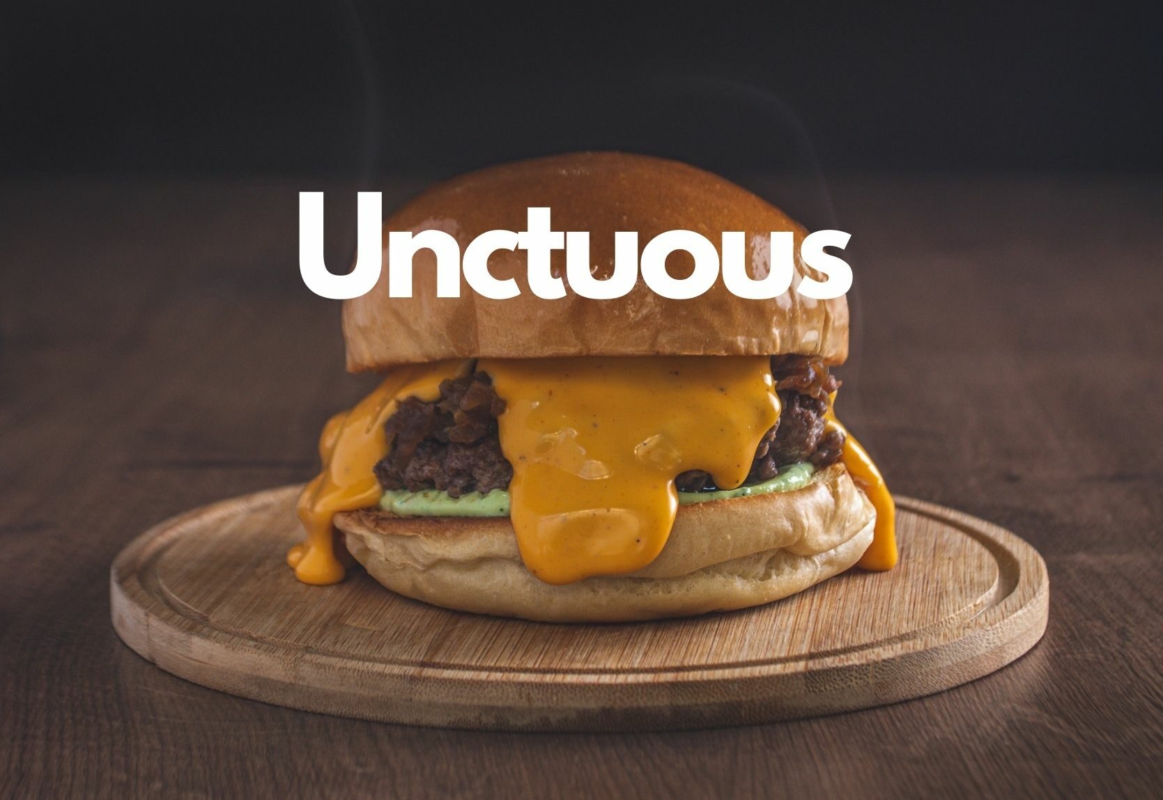 Graphic with a greasy burger and the word "Unctuous"