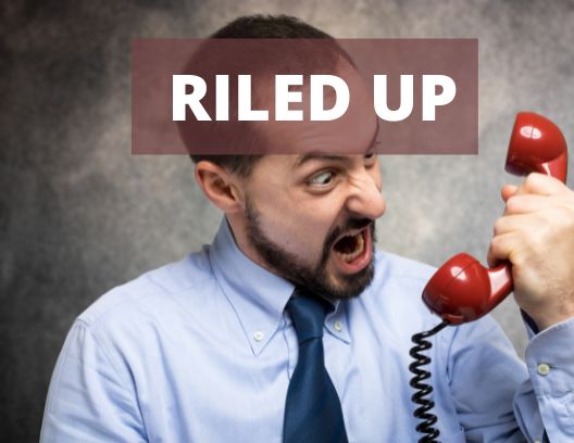 A graphic with an angry man on the phone and the words "Riled Up"