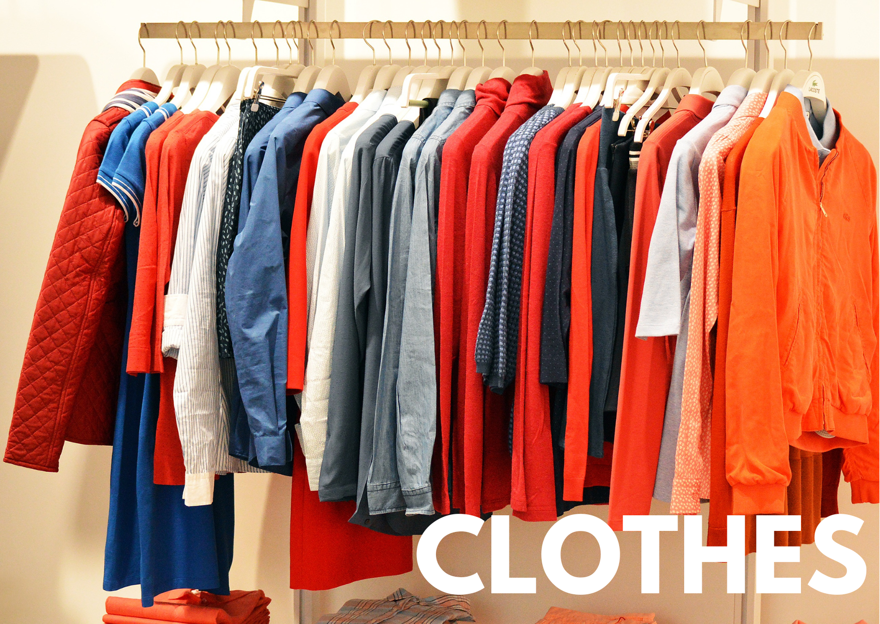 A picture of clothes on a rack with the caption "clothes"